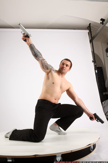 Man Adult Athletic White Fighting with gun Kneeling poses Pants