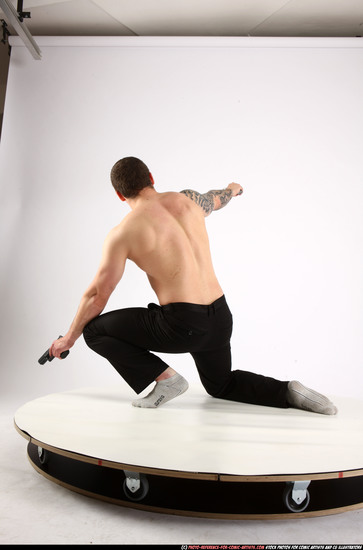 Man Adult Athletic White Fighting with gun Kneeling poses Pants