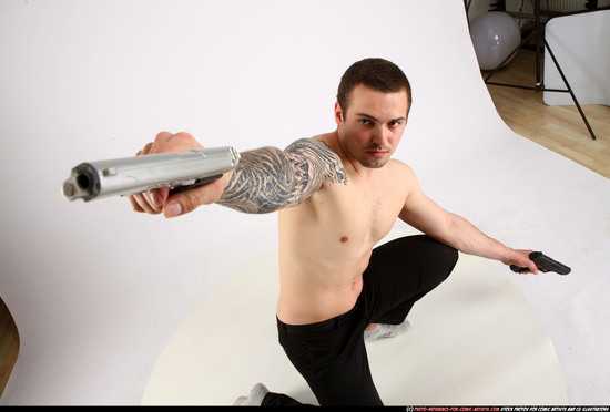 Man Adult Athletic White Fighting with gun Kneeling poses Pants