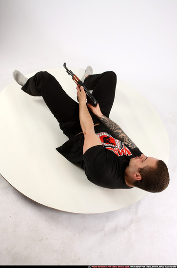 Man Adult Athletic White Fighting with submachine gun Laying poses Casual