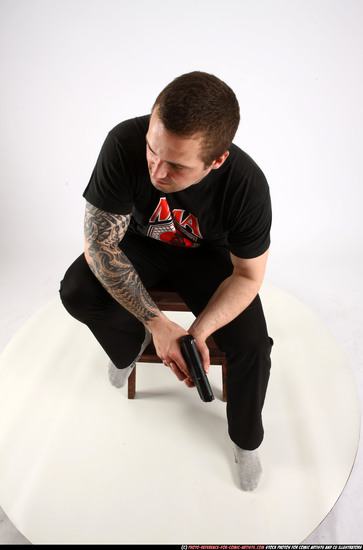 Man Adult Athletic White Fighting with gun Sitting poses Casual