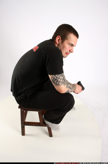 Man Adult Athletic White Fighting with gun Sitting poses Casual