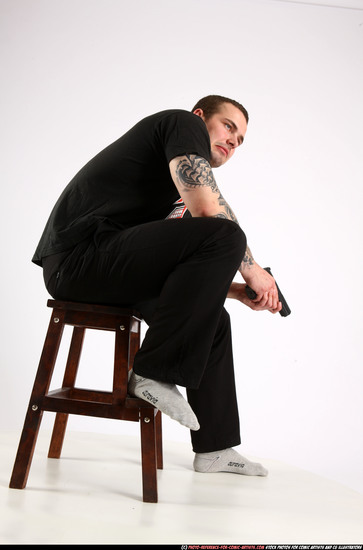 Man Adult Athletic White Fighting with gun Sitting poses Casual