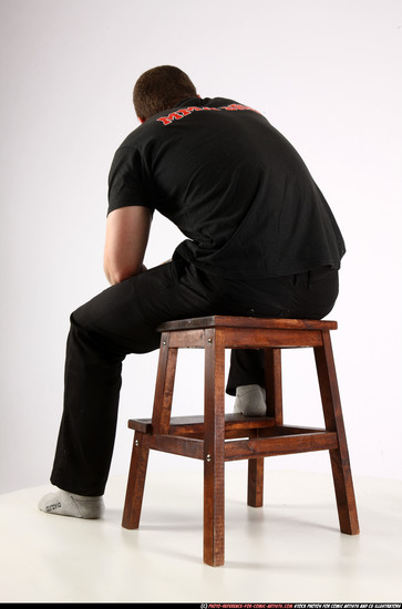 Man Adult Athletic White Fighting with gun Sitting poses Casual