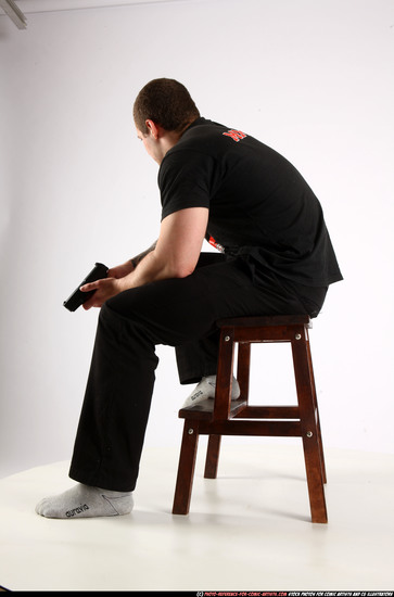 Man Adult Athletic White Fighting with gun Sitting poses Casual