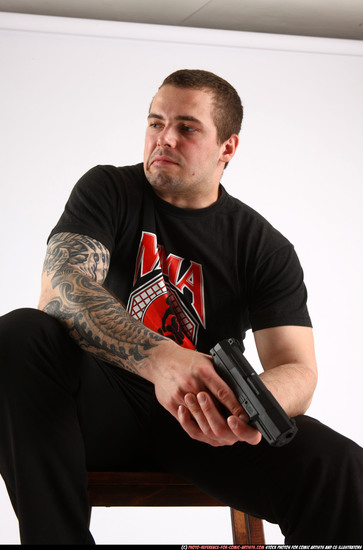 Man Adult Athletic White Fighting with gun Sitting poses Casual