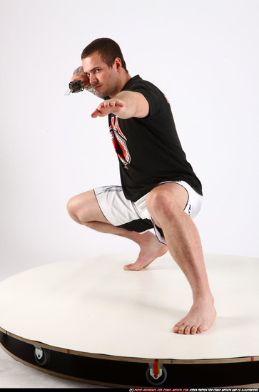 Man Adult Athletic White Fighting with sword Kneeling poses Sportswear