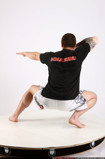 Man Adult Athletic White Fighting with sword Kneeling poses Sportswear