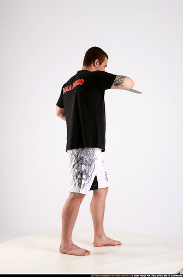 Man Adult Athletic White Fighting with knife Standing poses Sportswear