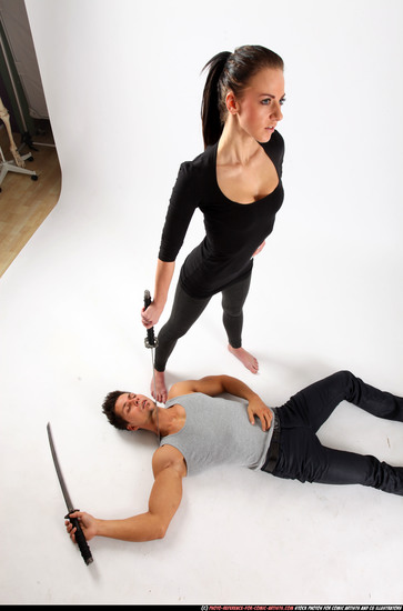 Man & Woman Adult Athletic White Fighting with sword Execution Casual