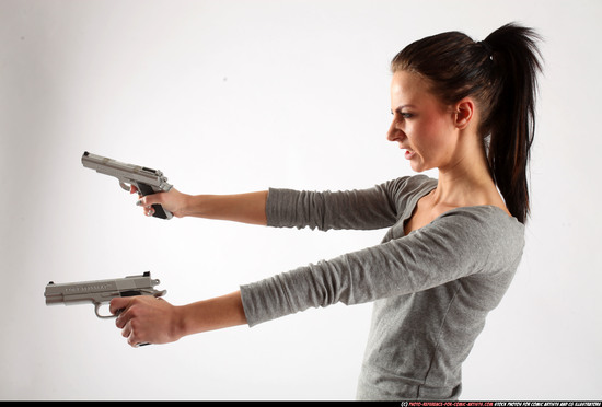 Woman Adult Athletic White Fighting with gun Standing poses Casual