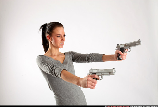 Woman Adult Athletic White Fighting with gun Standing poses Casual