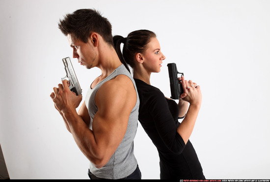 Man & Woman Adult Athletic White Fighting with gun Standing poses Casual