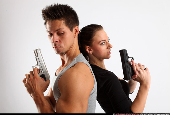 Man & Woman Adult Athletic White Fighting with gun Standing poses Casual