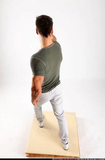 Man Adult Muscular White Fighting with gun Standing poses Casual