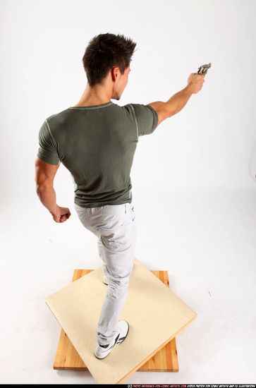 Man Adult Muscular White Fighting with gun Standing poses Casual