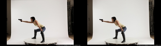 Woman Young Athletic White Fighting with gun Kneeling poses Casual