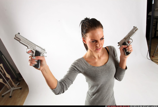 Woman Adult Athletic White Fighting with gun Standing poses Casual