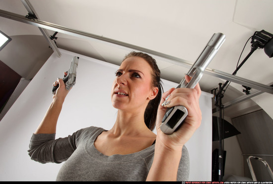 Woman Adult Athletic White Fighting with gun Standing poses Casual