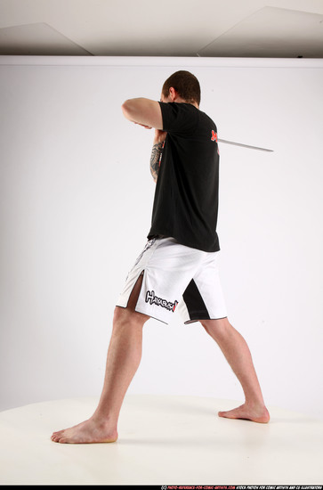 Man Adult Athletic White Fighting with sword Standing poses Sportswear