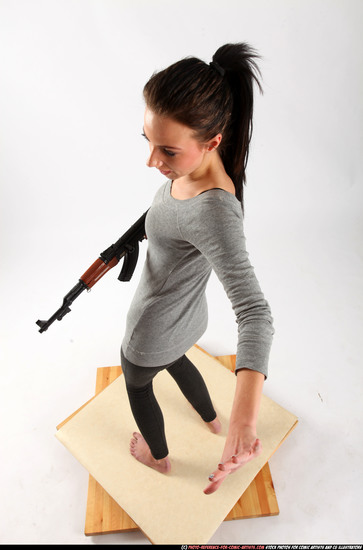 Woman Adult Athletic White Fighting with submachine gun Standing poses Casual