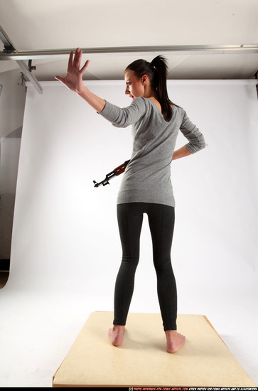 Woman Adult Athletic White Fighting with submachine gun Standing poses Casual