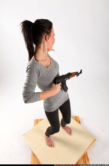 Woman Adult Athletic White Fighting with submachine gun Standing poses Casual