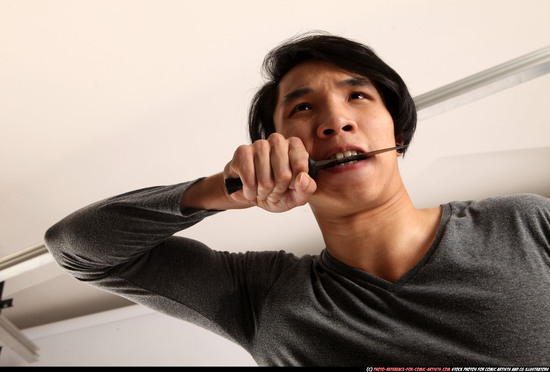 Man Young Athletic Fighting with knife Detailed photos Casual Asian