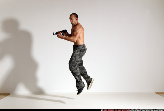 Man Adult Muscular White Fighting with submachine gun Moving poses Pants