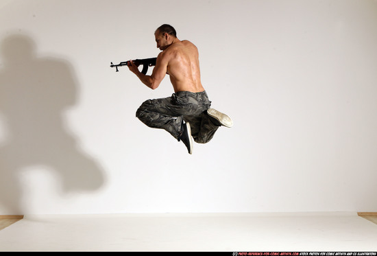 Man Adult Muscular White Fighting with submachine gun Moving poses Pants