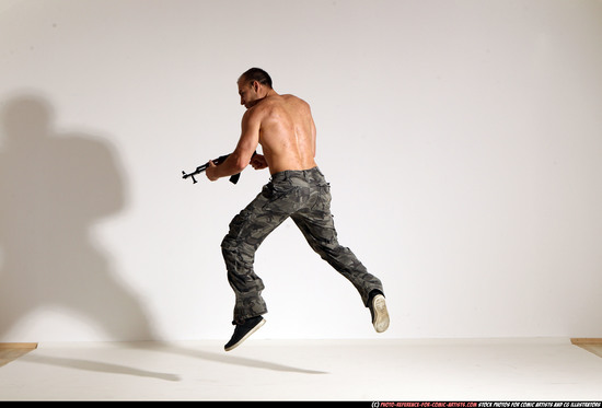 Man Adult Muscular White Fighting with submachine gun Moving poses Pants