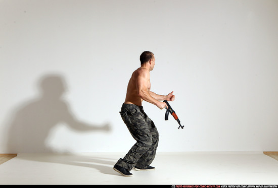 Man Adult Muscular White Fighting with submachine gun Moving poses Pants