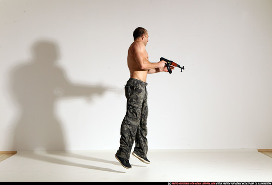 Man Adult Muscular White Fighting with submachine gun Moving poses Pants