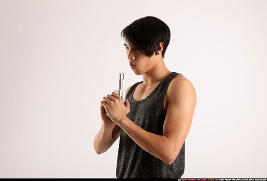 Man Young Athletic Fighting with gun Detailed photos Casual Asian