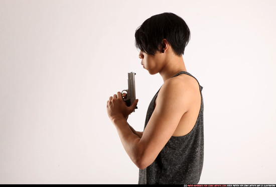 Man Young Athletic Fighting with gun Detailed photos Casual Asian