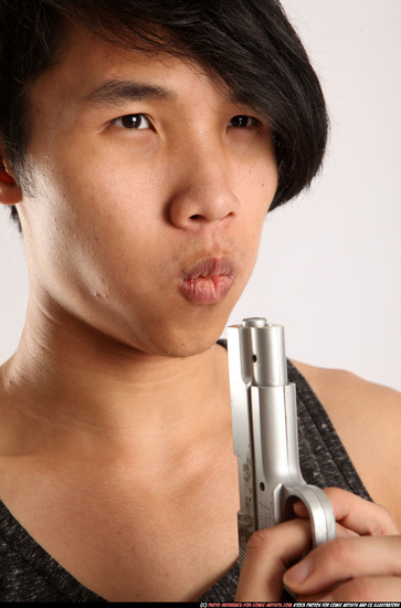 Man Young Athletic Fighting with gun Detailed photos Casual Asian