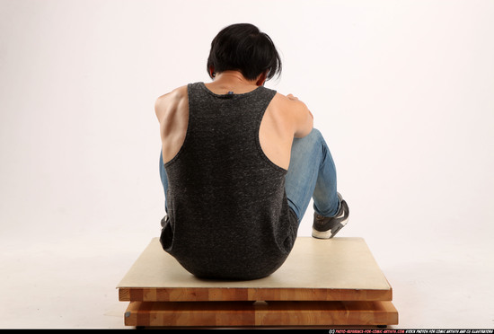 Man Young Athletic Fighting with gun Sitting poses Casual Asian