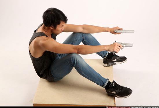 Man Young Athletic Fighting with gun Sitting poses Casual Asian