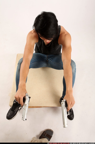 Man Young Athletic Fighting with gun Sitting poses Casual Asian