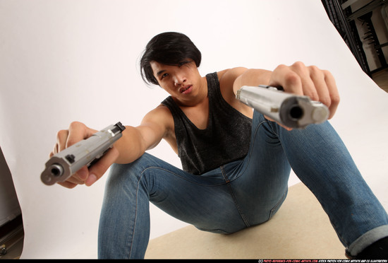 Man Young Athletic Fighting with gun Sitting poses Casual Asian