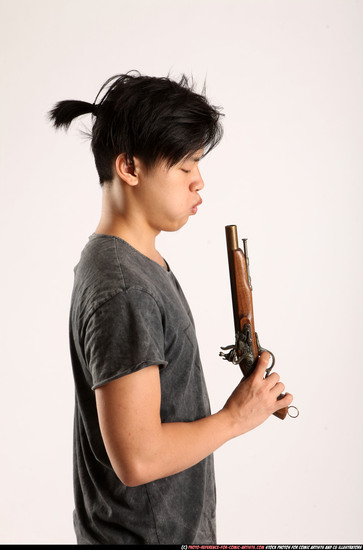 Man Young Athletic Fighting with gun Detailed photos Casual Asian