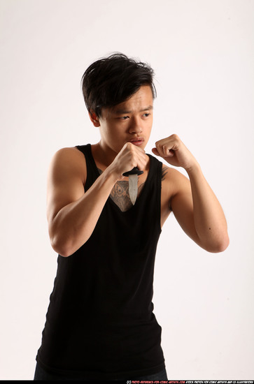 Man Young Athletic Fighting with knife Standing poses Casual Asian