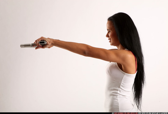 Woman Young Athletic Fighting with gun Standing poses Casual Latino