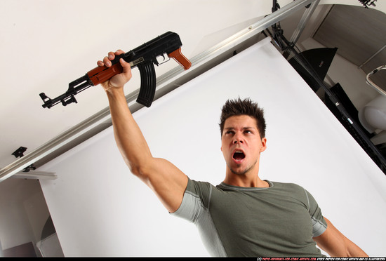 Man Adult Athletic White Fighting with submachine gun Standing poses Casual