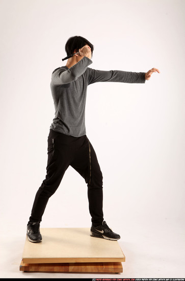 Man Young Athletic Fighting with knife Standing poses Casual Asian