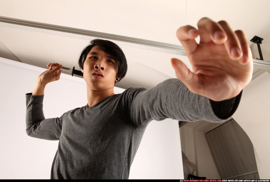 Man Young Athletic Fighting with knife Standing poses Casual Asian