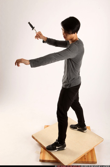 Man Young Athletic Fighting with knife Standing poses Casual Asian