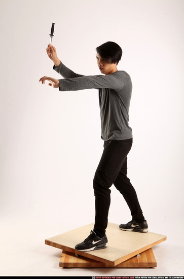 Man Young Athletic Fighting with knife Standing poses Casual Asian