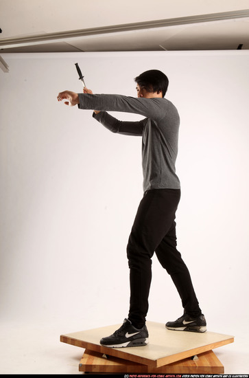 Man Young Athletic Fighting with knife Standing poses Casual Asian