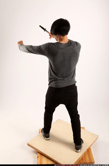 Man Young Athletic Fighting with knife Standing poses Casual Asian